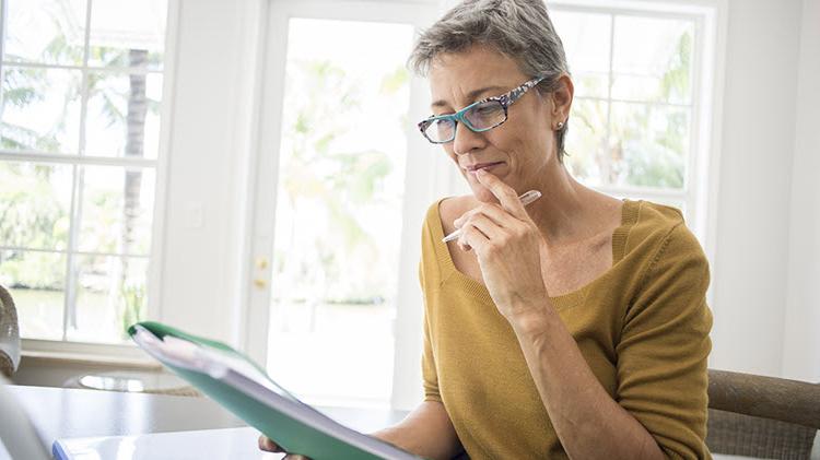 Woman reviewing her life insurance policy.