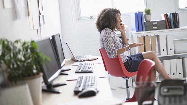 Woman on the phone in an office.